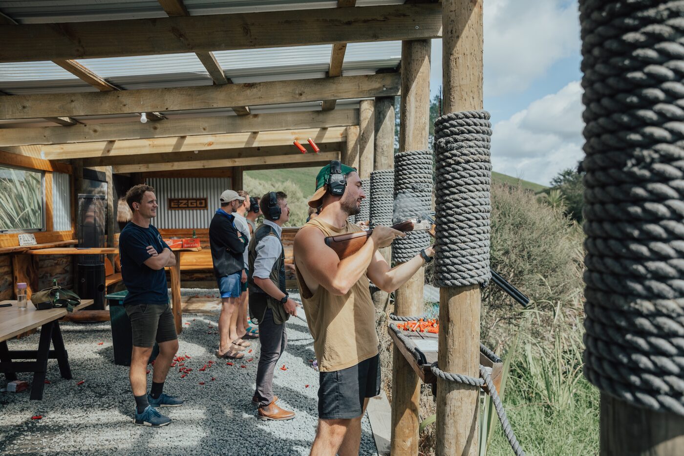 A guest taking a shot at the claybird stand at The Quails Nest